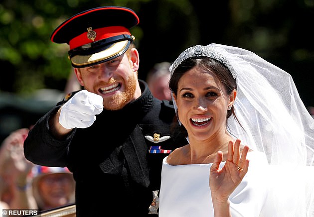 The Duke and Duchess of Sussex wave to the crowds after their wedding in 2018