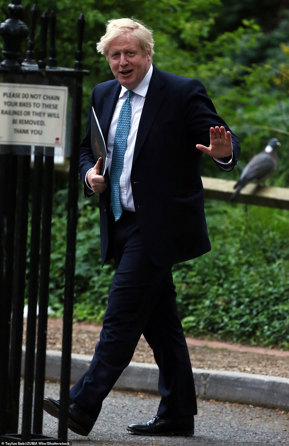 Boris Johnson (pictured yesterday) has urged families to adopt a 'heavy dose of caution' with the ban on indoor socialising and hugs finally ending on Monday