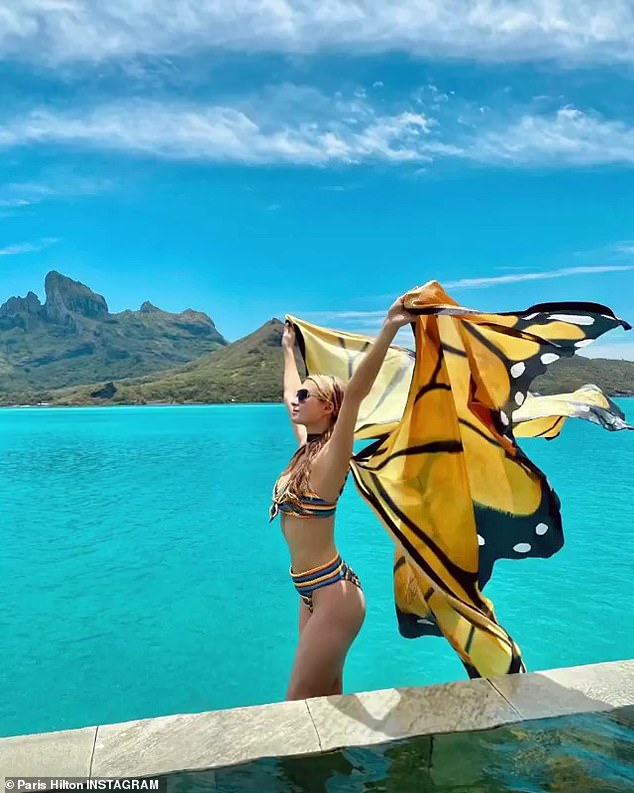 Bikini time: Over the weekend she shared this image as she said, 'Fly as free as a butterfly. Thinking of memories in Bora Bora... who’s ready for summer? Wishing you all a beautiful weekend☀️'