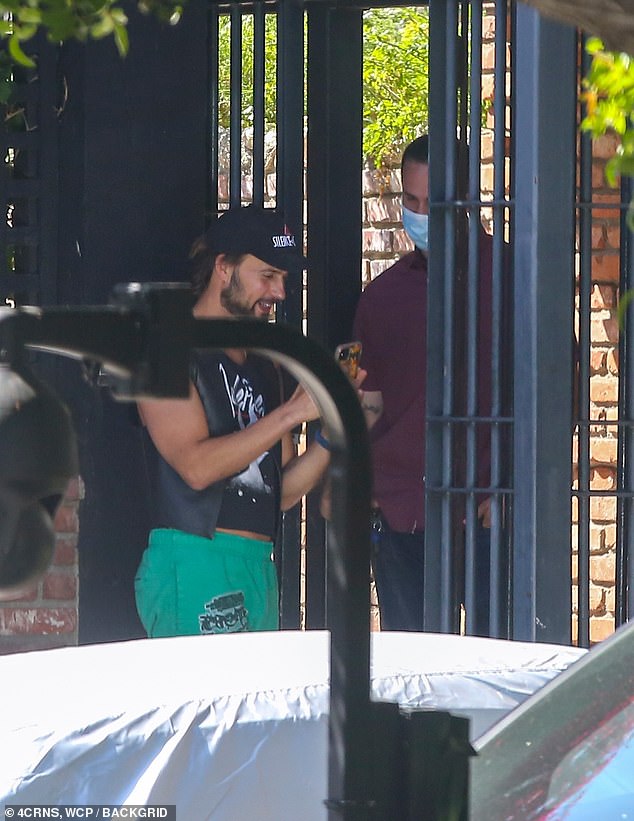 Returning to the routine: Fischer ran his errands and chatted with Gaga's security guard at the gate outside of her home