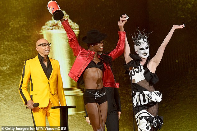 First winner: RuPaul made a surprise appearance to accept Best Reality cast with makeup artist Gottmik and season 13 winner Symone on Monday's 2021 MTV Movie & TV Awards: Unscripted