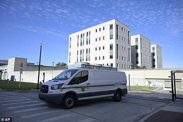 An Orange County Corrections transport vehicle leaves the federal courthouse before a hearing for Joel Greenberg on Monday