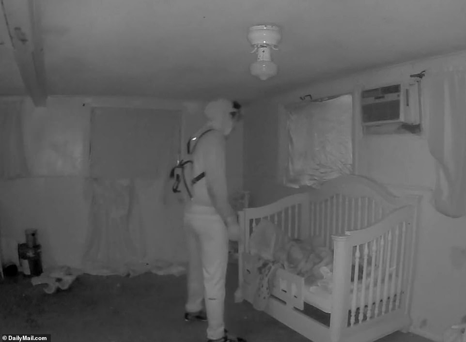 The disturbing surveillance tape shows suspect Darriynn Brown creeping into the bedroom just before 5am, wearing a hoodie, sweatpants, a backpack and sneakers. He is seen hovering over Cash who is sleeping alongside his twin brother Carter in a toddler bed