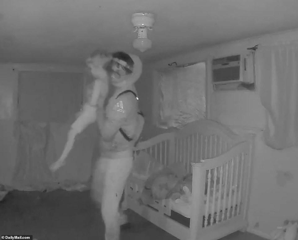 Brown appears to be at pains not to wake the two boys throughout the video. Then, in one swift motion, he quickly picks up Cash, who is immediately awoken, and bolts out of the room with the toddler in his arms