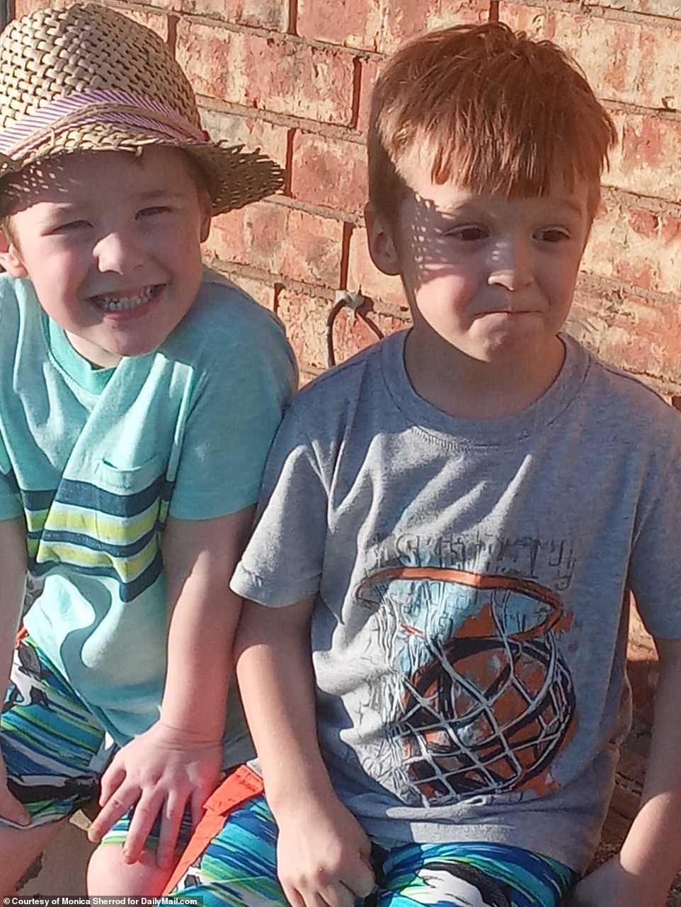 Cash, who had been staying in his father's ex-girlfriend home, was asleep next to his twin brother Carter (left) when he was snatched from bed and killed shortly after