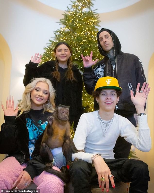 The Blink -182 drummer is pictured with Alabama, Landon and sister Atiana De Lay Hoya, whose father is former world champion boxer Oscar De Lay Hoya