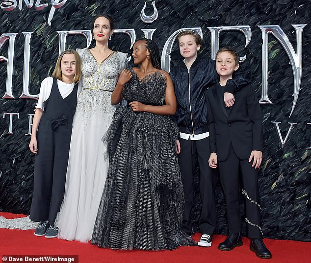 Her little ones: Jolie also has others to help her with Maddox, 19, Pax, 17, Zahara, 16, Shiloh, 14, and twins Knox and Vivienne, 12. Seen in 2019 in London