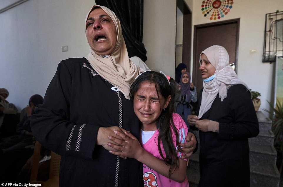 The sister (right) and relatives of Palestinian Mahmoud Shtawi, 19, cry during his funeral on Wenesday in Gaza City after he was killed in an Israeli air strike