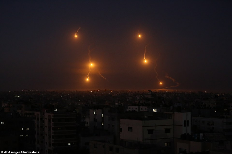 Rockets are launched from Gaza City, towards Israel early on Wednesday as fighting between the two sides continues