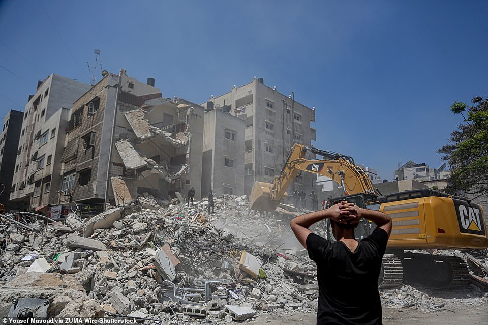 Palestinians search for victims under the rubble of a destroyed building in the residential Al-Rimal neighborhood of Gaza City on Monday this week following an Israeli bombing raid