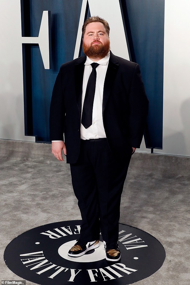Interesting: The real life story will be centered around Keene who is offered his freedom in exchange for coaxing a confession out of a suspected serial killer (played by Paul Walter Hauser; pictured at the Vanity Fair Oscar Party in February 2020) who is a fellow inmate