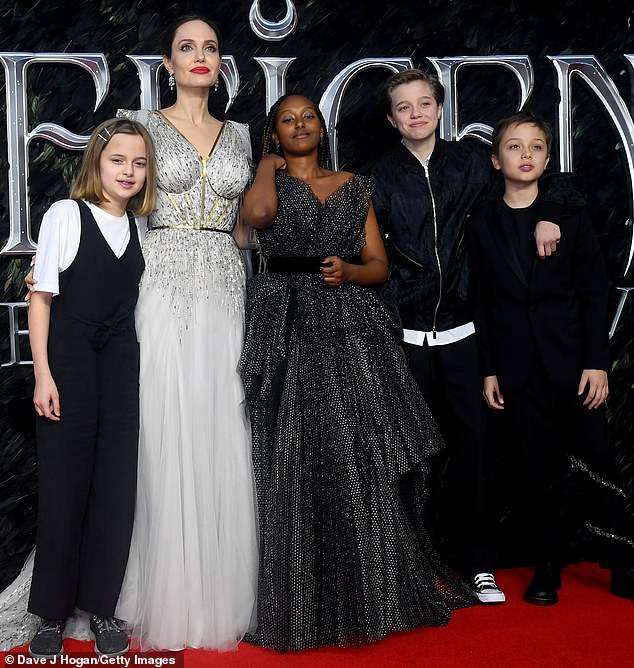 Good group: Angelina Jolie has been split from Brad Pitt for five years now. And the Oscar winning star, 45, told E! News on Monday that her kids have been helping take care of her; she is pictured with four of her six kids in 2019