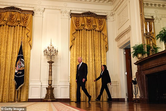 Joe Biden and Kamala Harris arrive in the East Room of the White House without masks on Monday, making use of new CDC guidelines that fully vaccinated people no longer have to wear masks in most circumstances