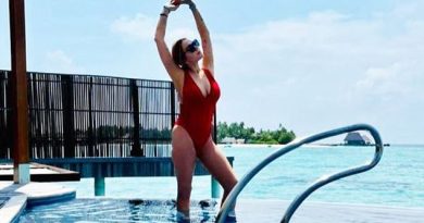 Lindsay Lohan wears plunging red swimsuit in Maldives Instagram photo
