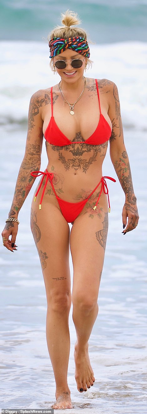 Wow factor: Tina Louise flaunted her fabulous figure in a crimson colored thong bikini
